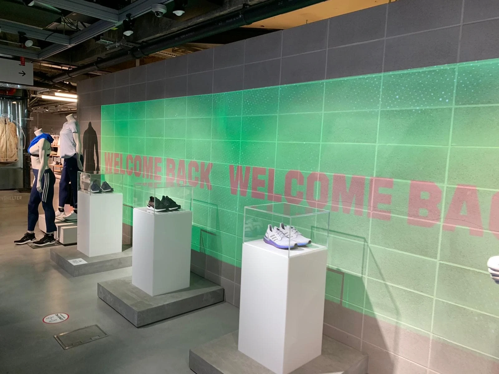 adidas store with welcome back sign